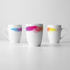 Three RNIB mugs arranged to show the full wraparound design.